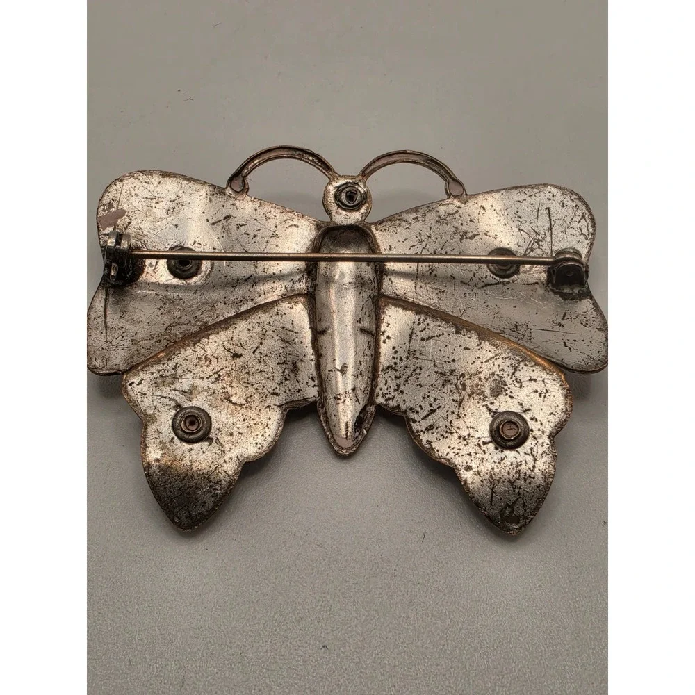 Undefined butterfly brooch